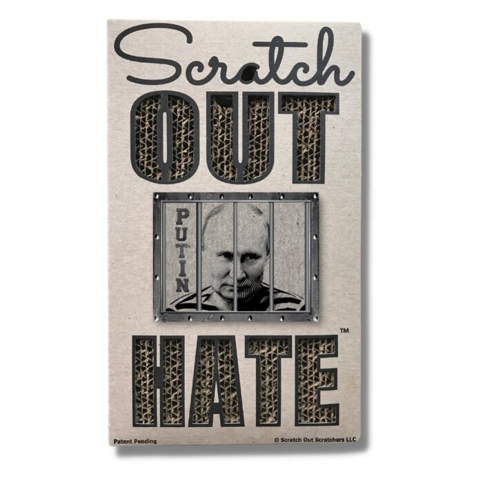 A brown cardboard cat scratcher that reads: "Scratch Out Hate" with a wood-cut design of Putin behind bars.